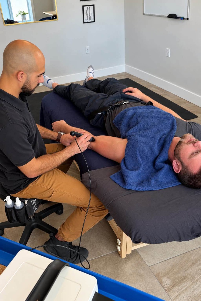 Shelby using a handheld treatment tool during a session
